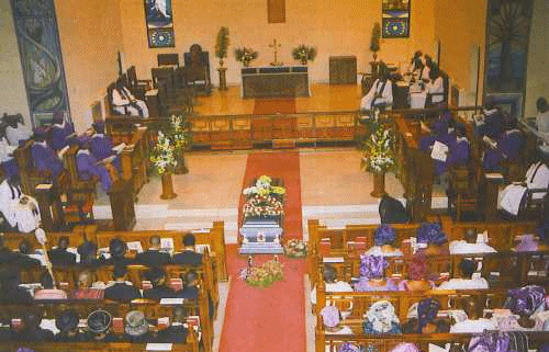 A group of people attending a funeral