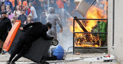 Rioters trying to burn down a hotel